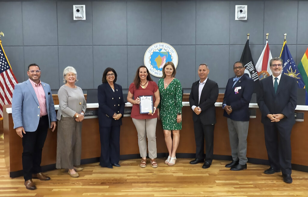 City Manager Brian L. Barroso, Commissioner Monica Haskell, Mayor Danise “DeeDee” Henriquez, Senior Vice President of Guidance/Care Center Maureen Dunleavy and Board Member Michele White, Commissioner Donie Lee, Aaron Castillo, and Sam Kaufman celebrate the proclamation of Guidance/Care Center Week. Vice Mayor Lissette Carey and Commissioner Mary Lou Hoover attended virtually via Zoom. 